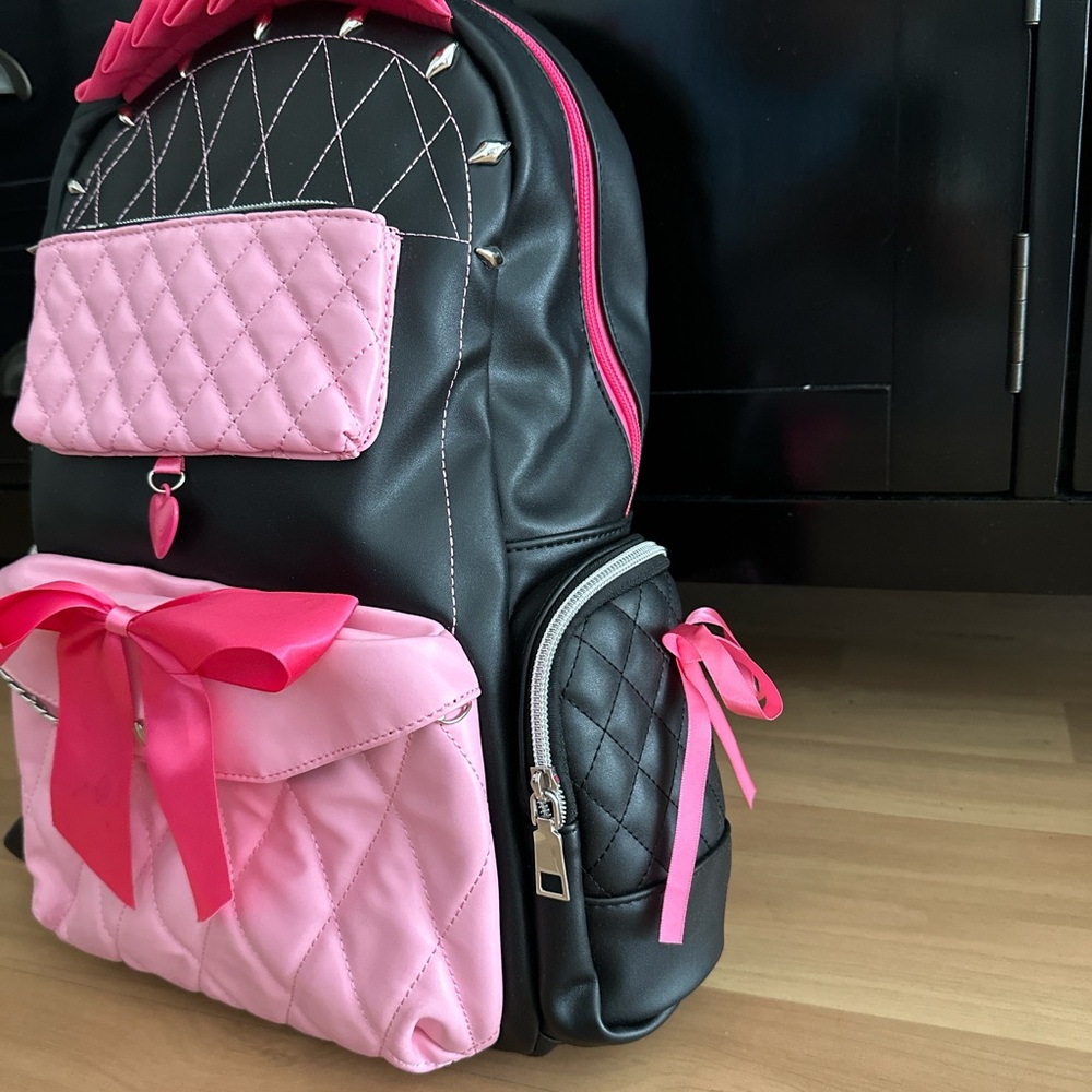 PU leather Princess Alex backpack, featuring pink bows and a heart-shaped charm.